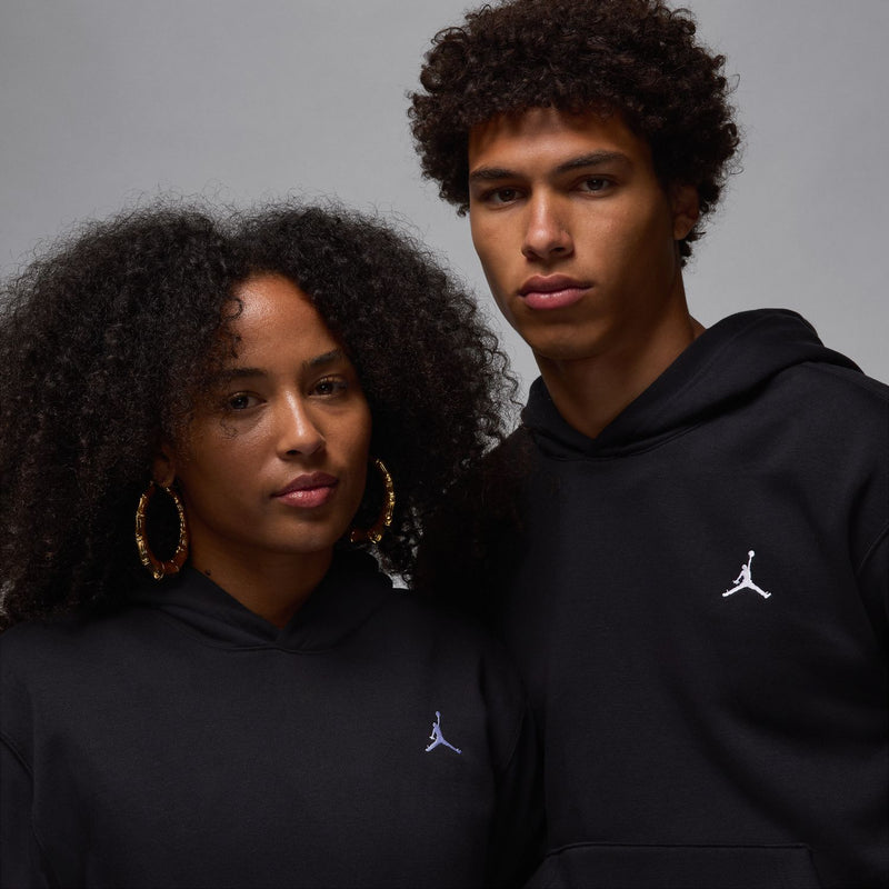 Men's black fleece pullover hoodie with chest Jumpman logo, close-up
