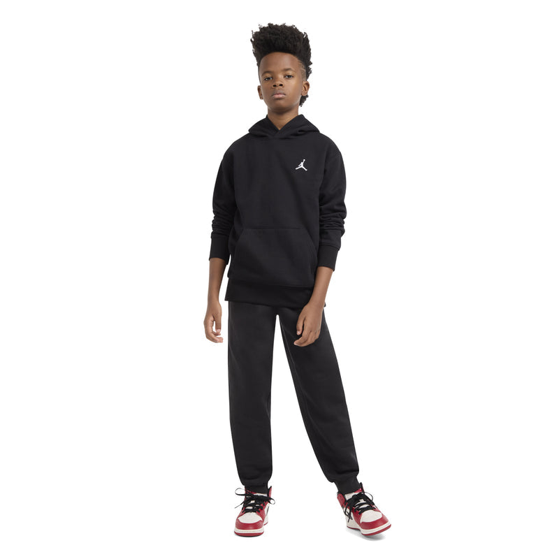 Youth black fleece pullover hoodie with hood and Jumpman logo, front three-quarter view.
