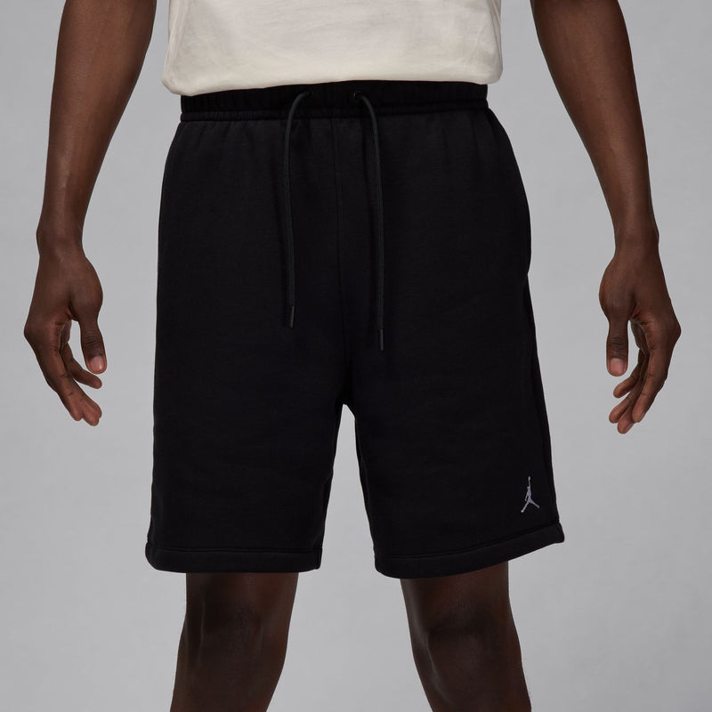 Men's black fleece shorts, close front view; drawstring waistband and side logo.