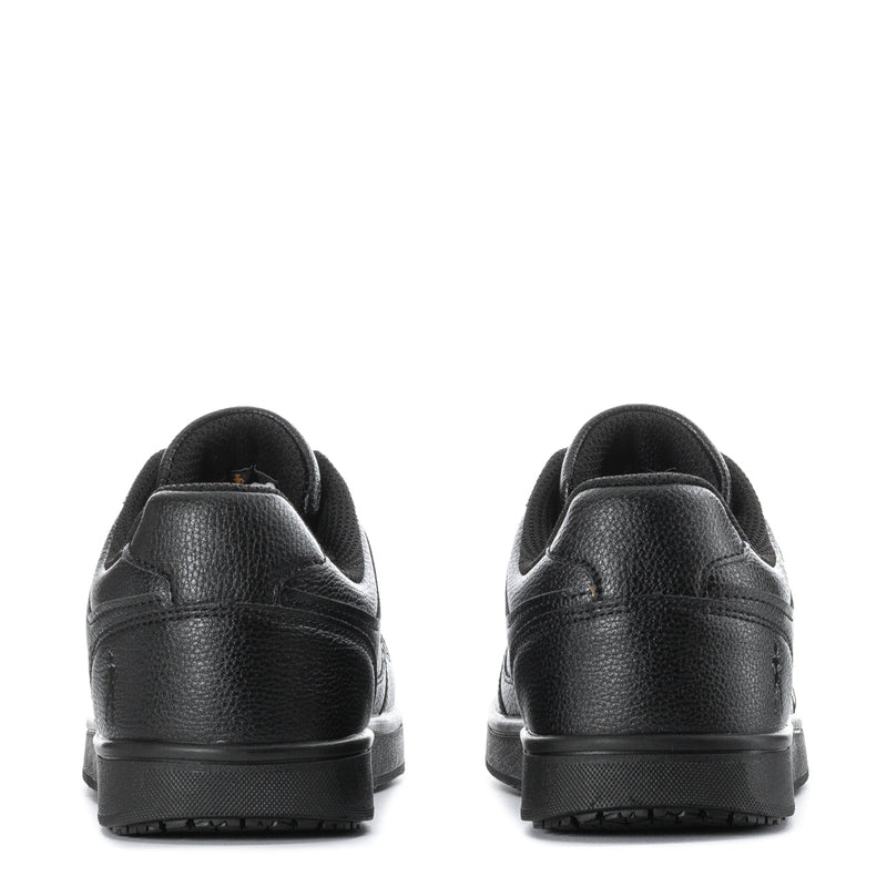 Black low-top sneakers with rear tab, cushioned collar, and rubber outsole