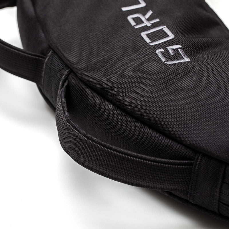 Close-up of a black Bulgarian Sandbag with stitched handles and partial white embroidered text.