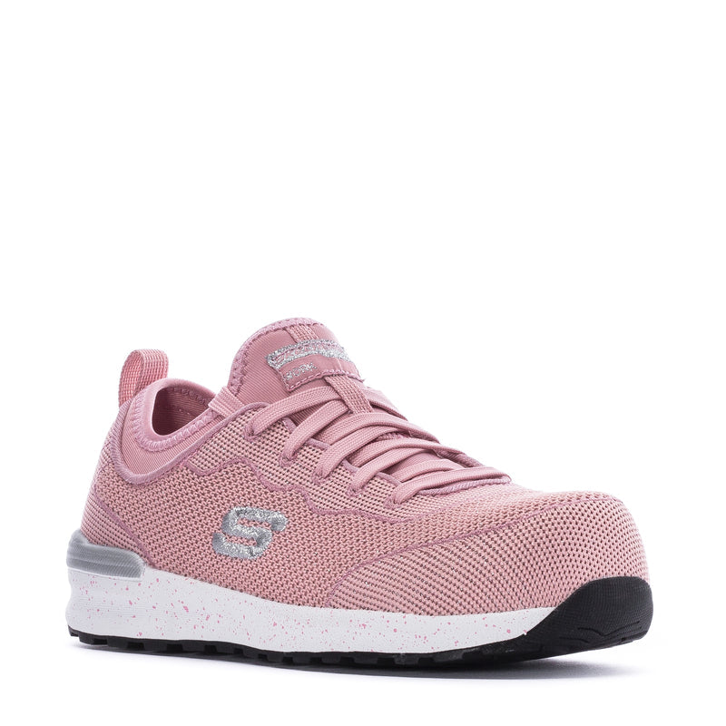 Pink low-top lace-up sneaker with textured upper, logo patch, and rubber sole
