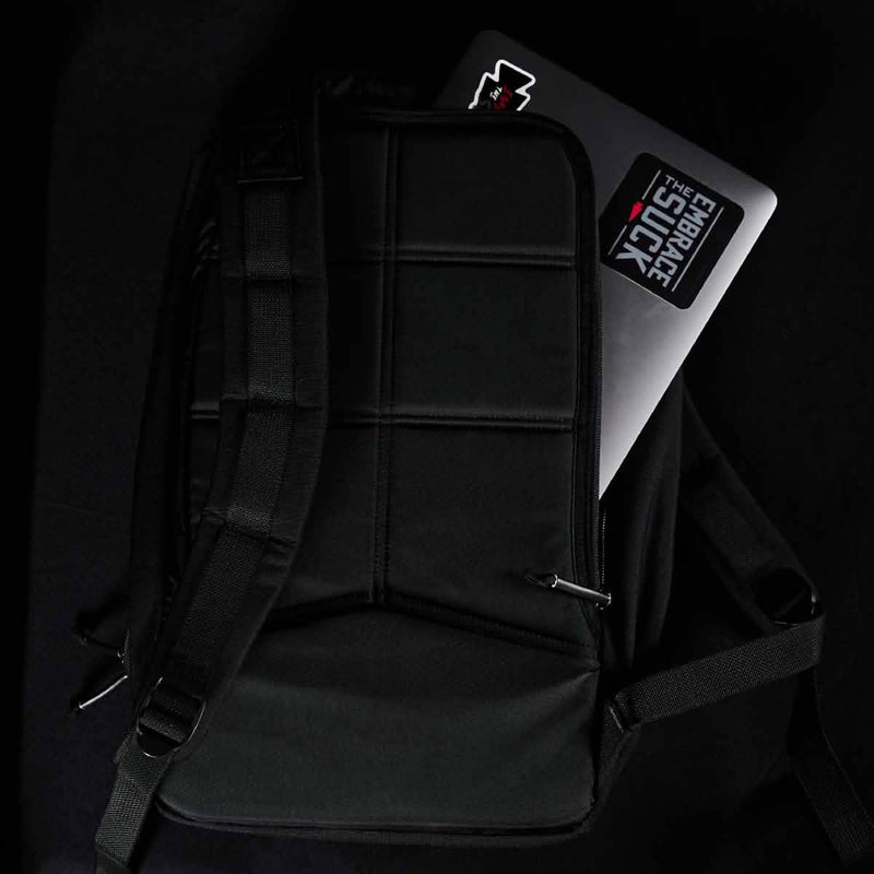 GORUCK black rucksack with laptop in padded compartment on dark background