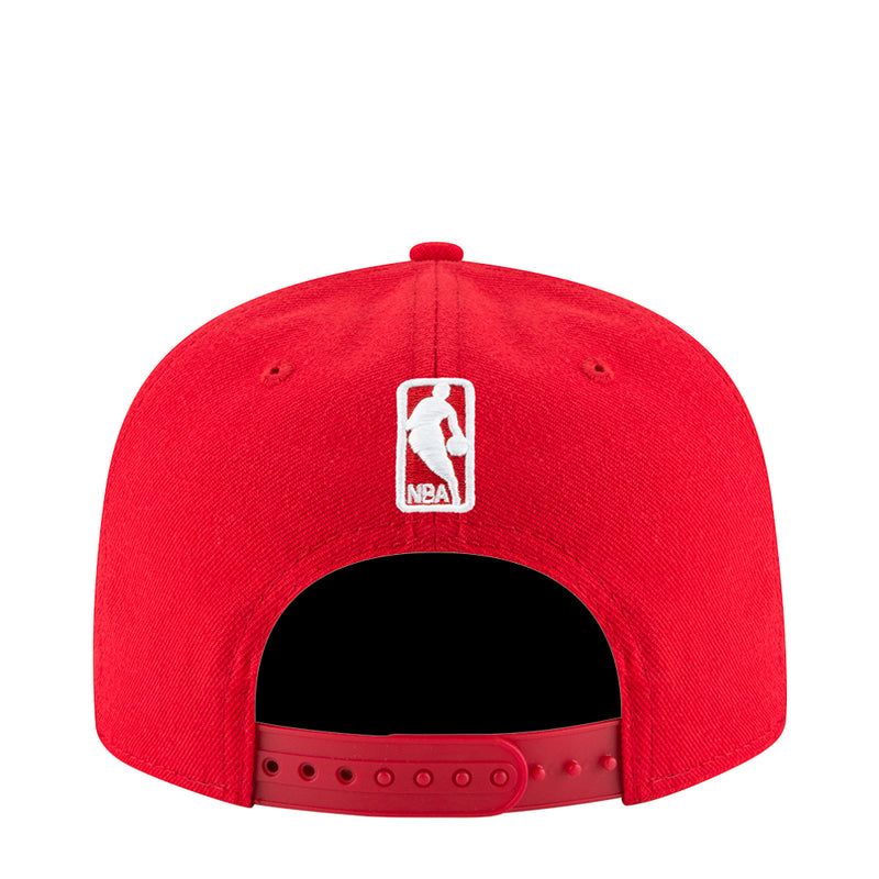 Red baseball cap rear view with NBA logo patch and adjustable snapback