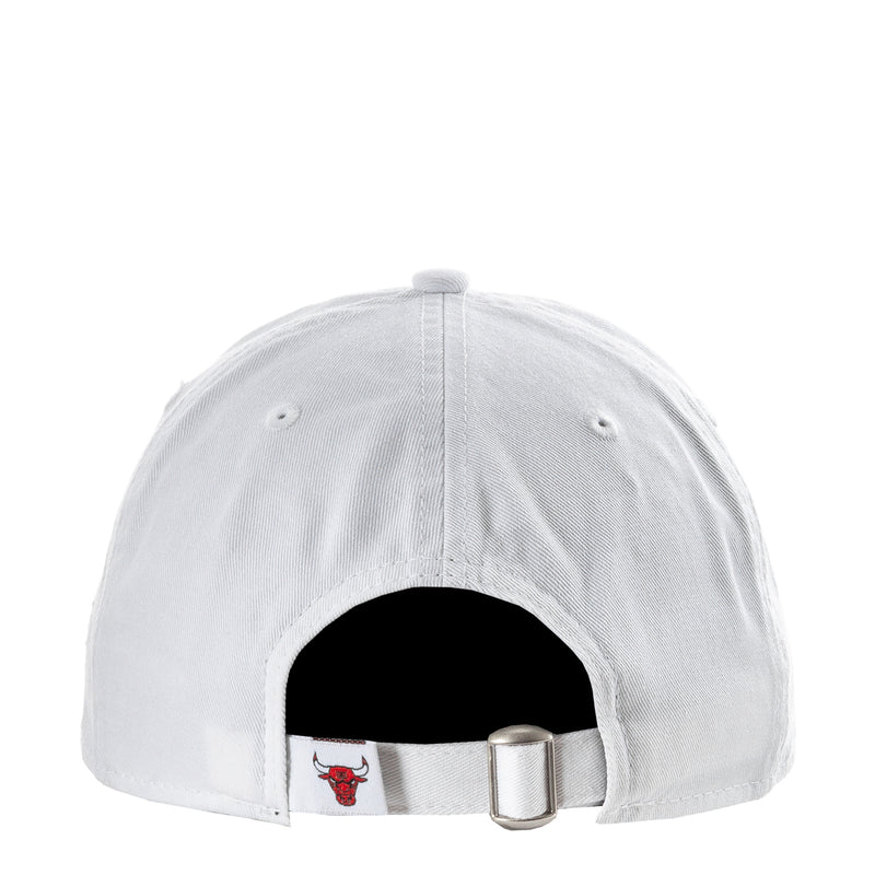White baseball cap with interior strap and red bull patch