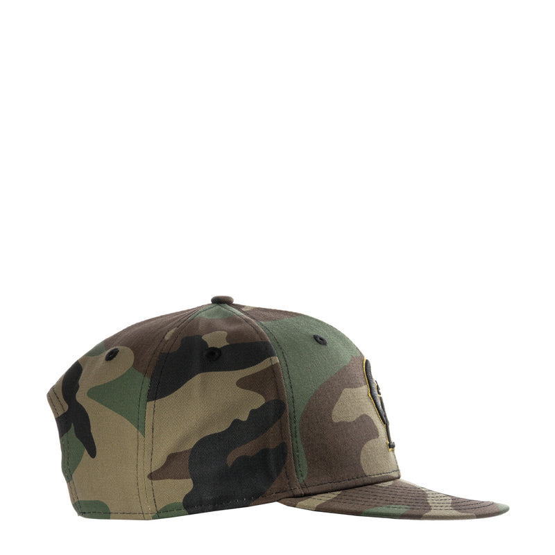 Camo baseball cap with side profile and stitched front panels, snapback closure