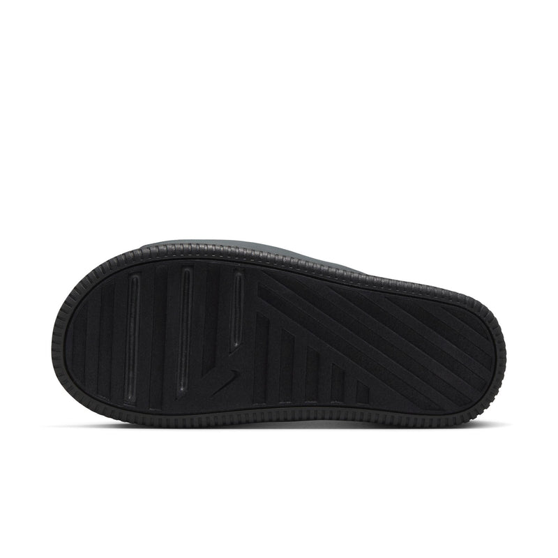 Bottom view of women's black slide sandals with textured tread and swoosh