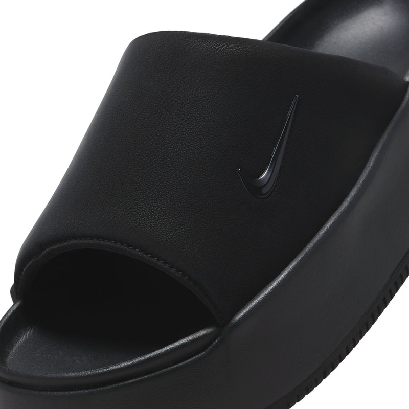 Close-up of women's black slide sandals with swoosh detail and smooth strap