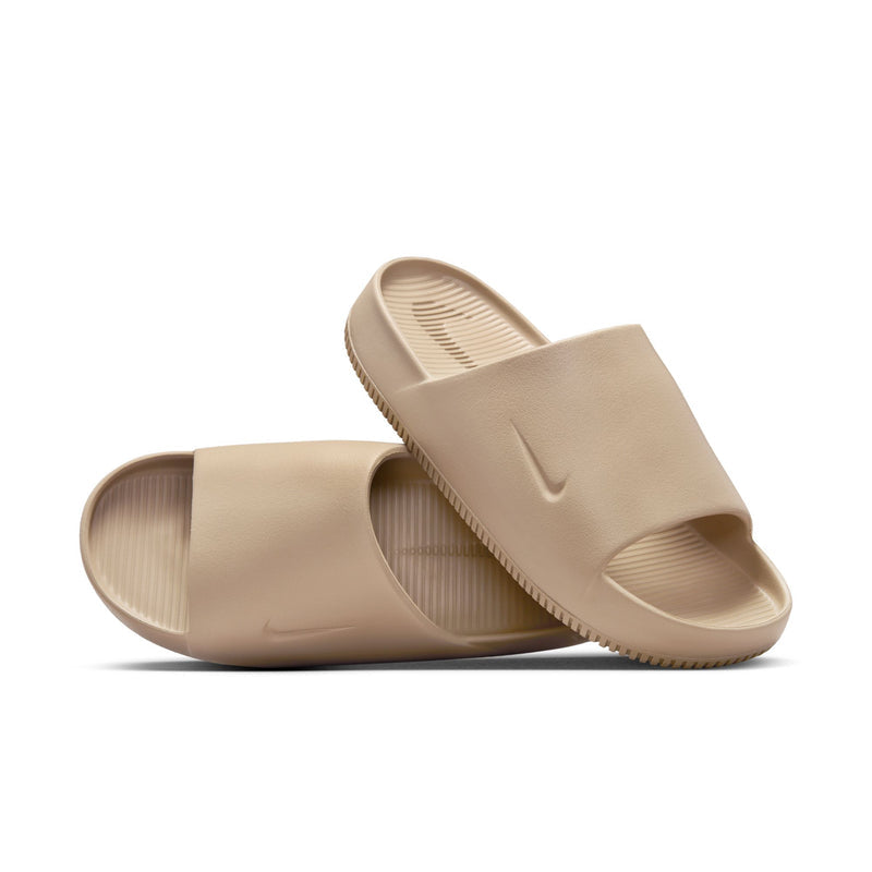 Khaki slide sandals with open toe, Nike swoosh, and textured footbed