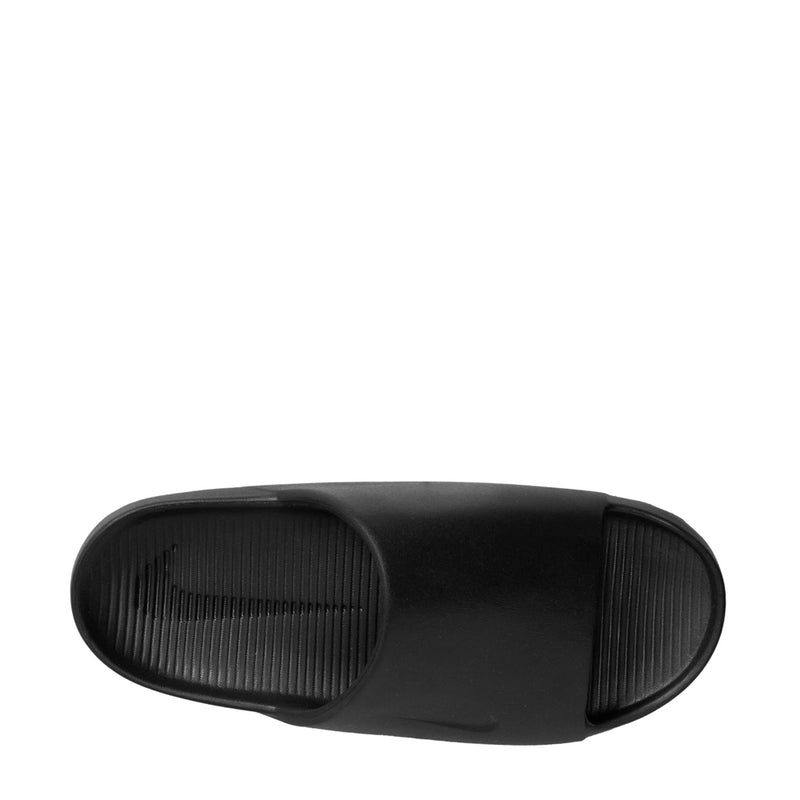 Black slide sandal outsole tread shown from the bottom