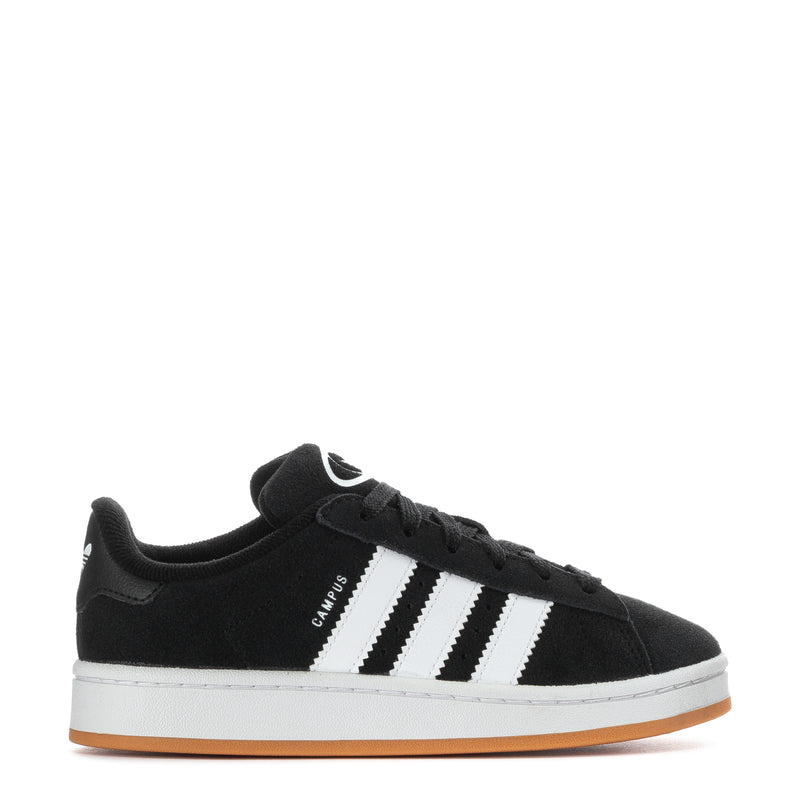 Kids black low-top sneakers with white 3-stripe design and gum rubber sole