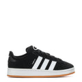 Kids black low-top sneakers with white 3-stripe design and gum rubber sole