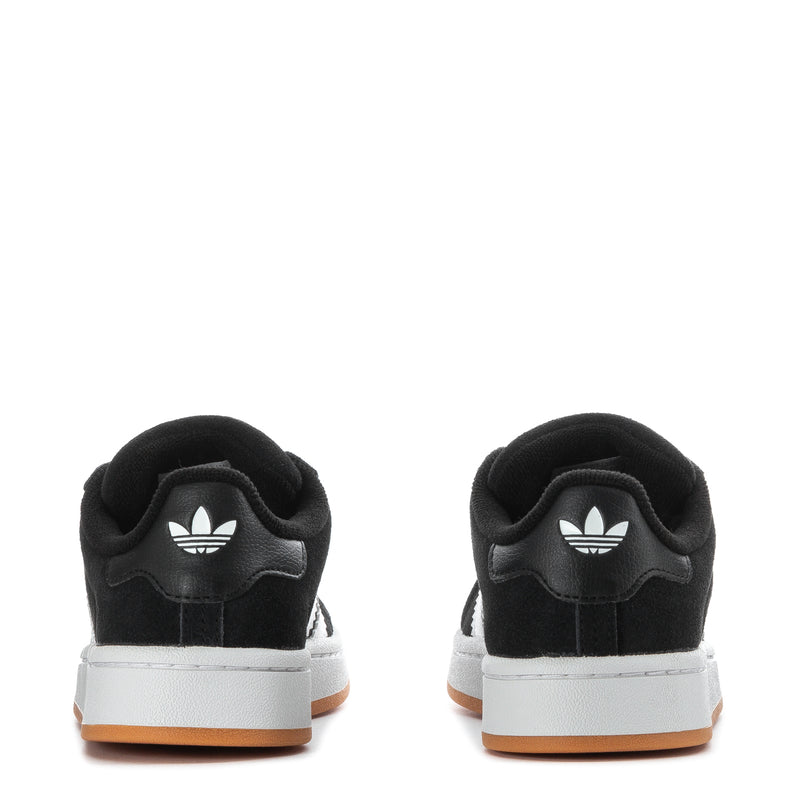 Kids black sneakers, back view with white heel branding and gum-accented sole