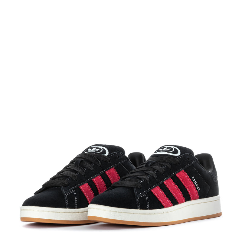 Pair of men's black sneakers with red three stripes, laces, and logo on tongues