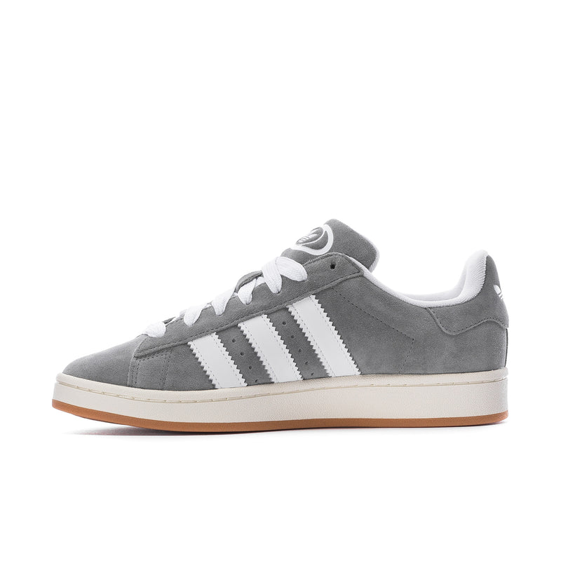 Men's grey low-top sneakers with white three-stripe design and gum-brown sole