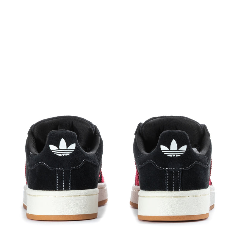 Men's black sneakers back view with white trefoil heel logo and red stripe accents