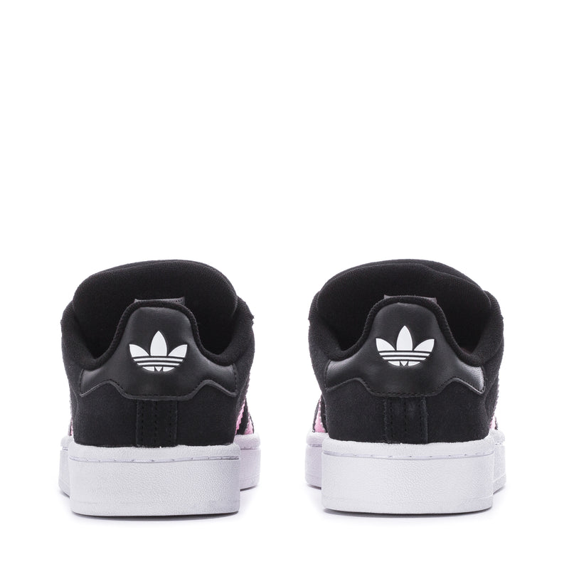 Women’s black low-top sneakers with white adidas trefoil heel and white sole