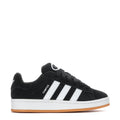 Youth black low-top sneakers with three white stripes and gum outsole