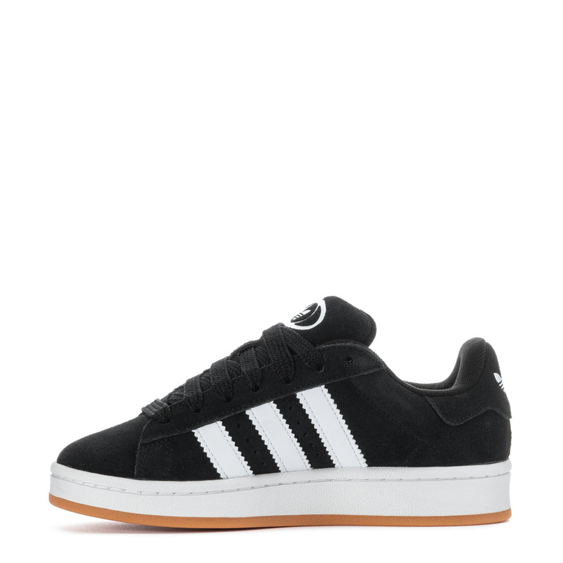Youth black low-top sneakers front view with white stripes and gum outsole