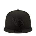 Black snapback cap with embroidered bird logo on front