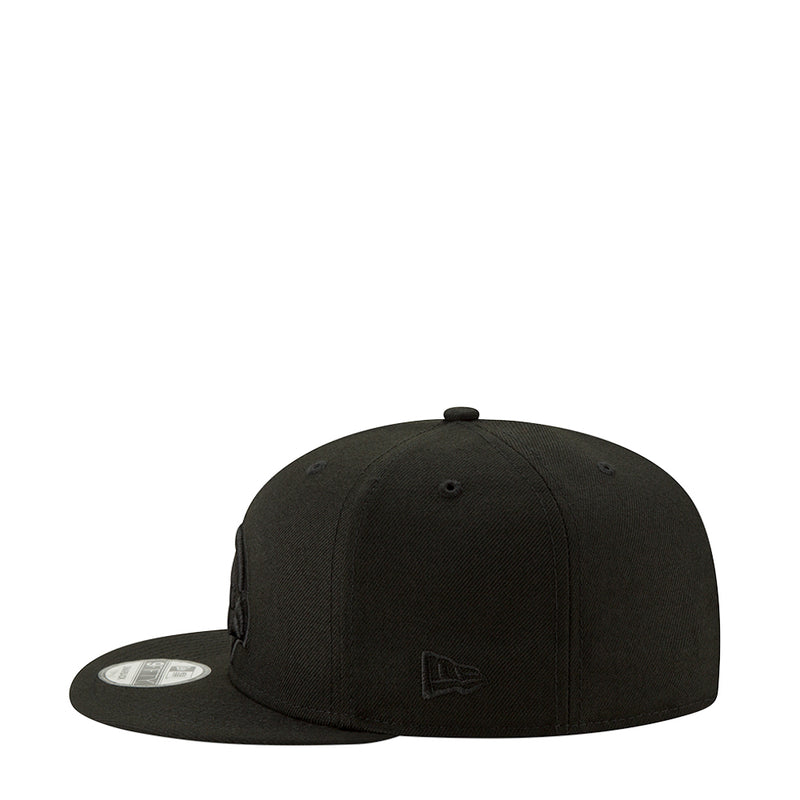 Black snapback cap with small embroidered bird logo patch