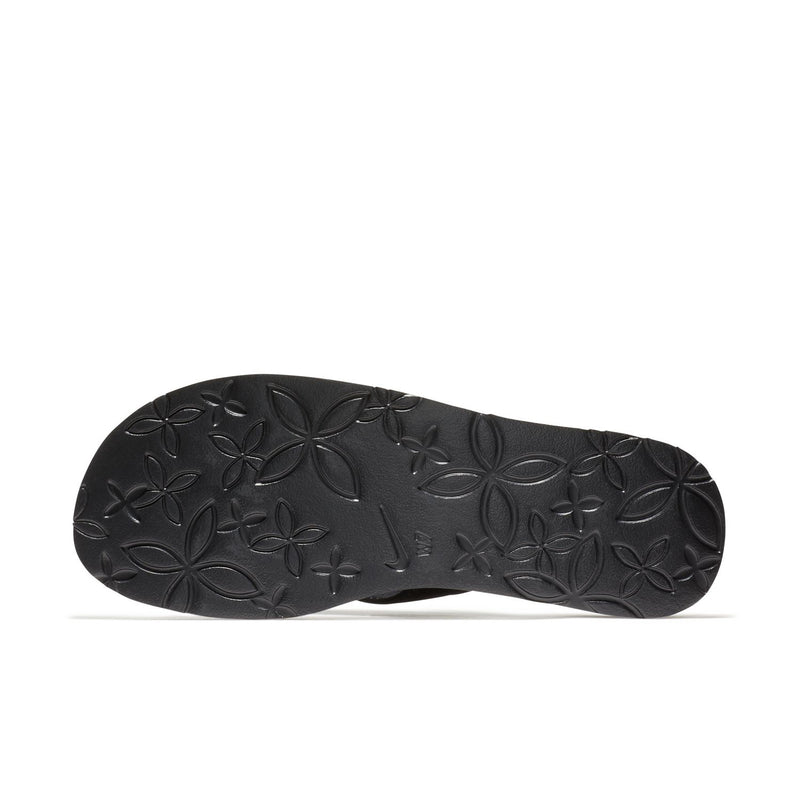 Women's thong sandal outsole with dark floral embossed tread