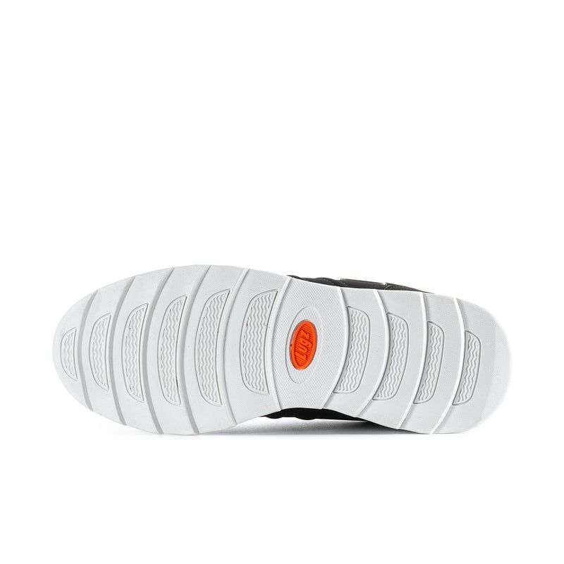 White rubber outsole with tread pattern and small orange brand mark