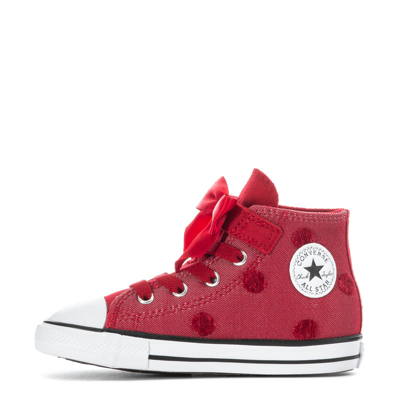Toddler high-top sneakers, red canvas with bow, eyelets, and Converse All Star patch