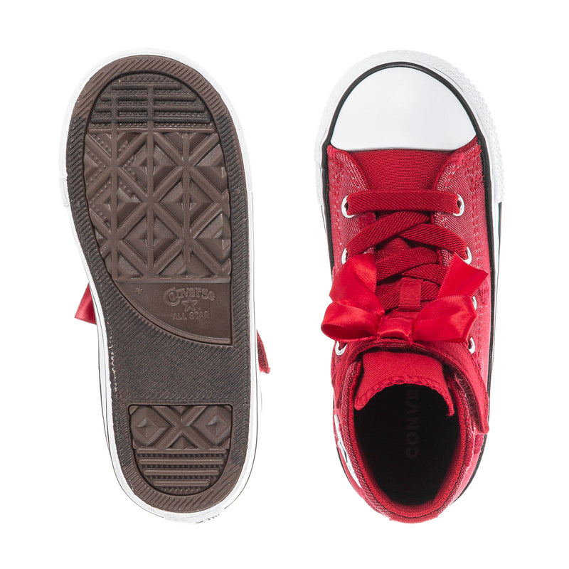 Toddler high-top sneakers showing tread sole and red canvas heel