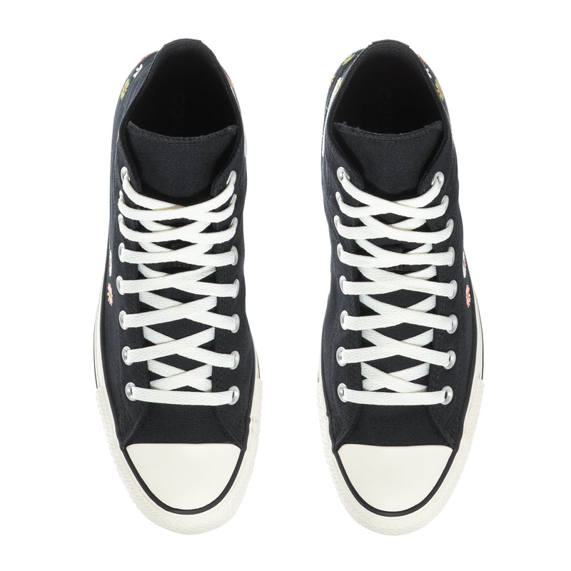 Pair of black high-top sneakers showing white crisscross laces and toe caps