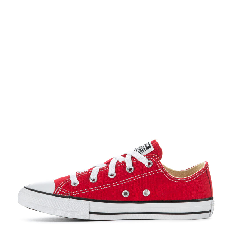 Kids red low-top Converse sneakers with white laces and side eyelets