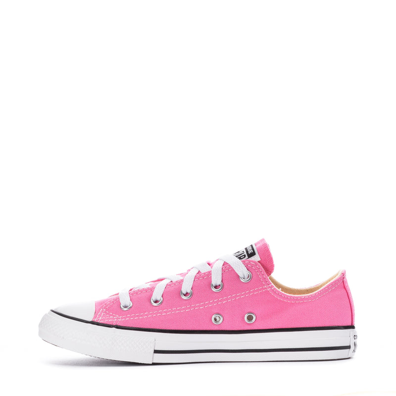 Pink lace-up low-top canvas sneakers with white rubber sole and toe cap.