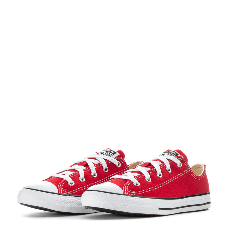 Pair of kids red low-top sneakers with white laces and All Star heel patch