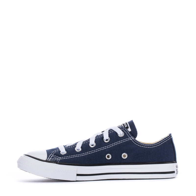 Kids' navy low-top canvas sneakers, side view with metal eyelets