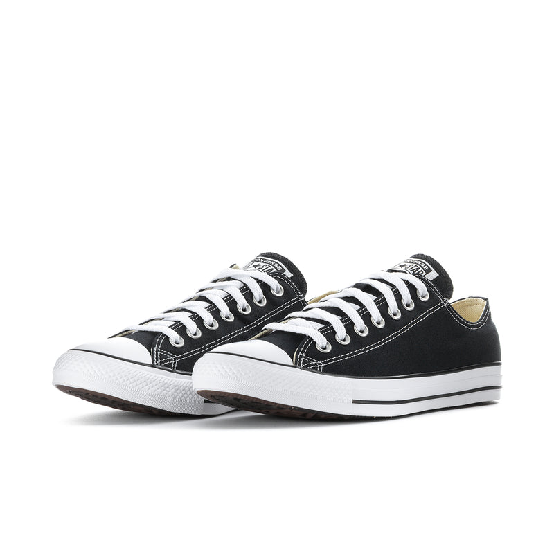 Pair of men's black canvas low-top sneakers with white laces and toe caps