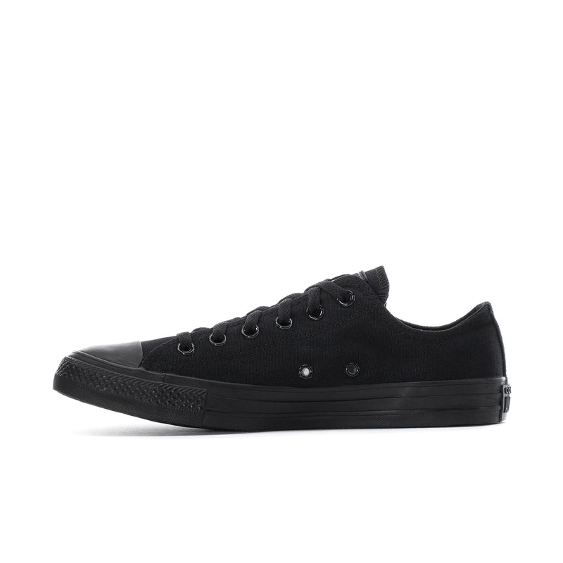 Black low-top lace-up canvas sneaker with eyelets and rubber sidewall sole