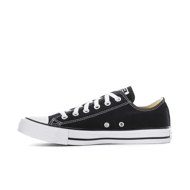 Men's black canvas low-top sneakers with white laces and rubber toe cap