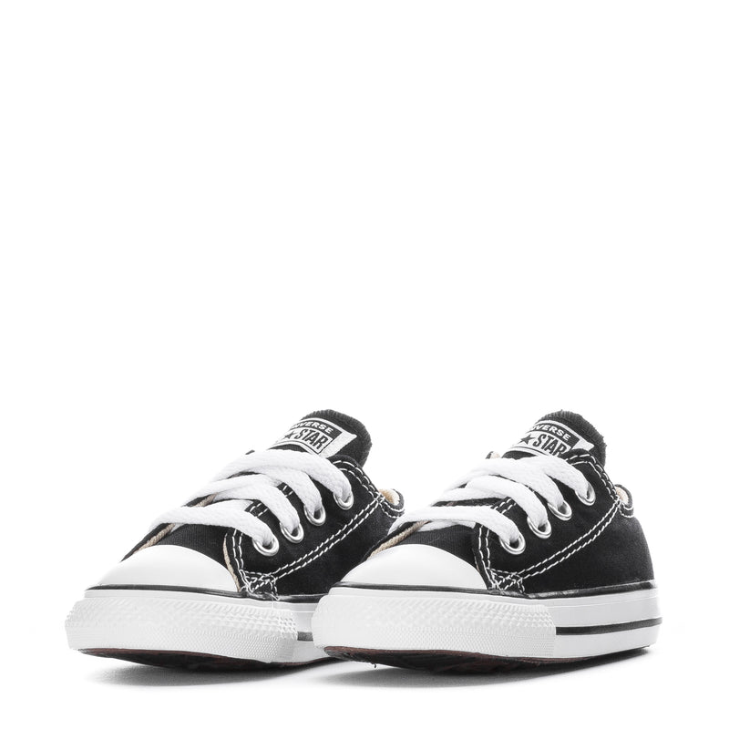Toddler pair of black and white Chuck Taylor All Star ox sneakers with classic stitching