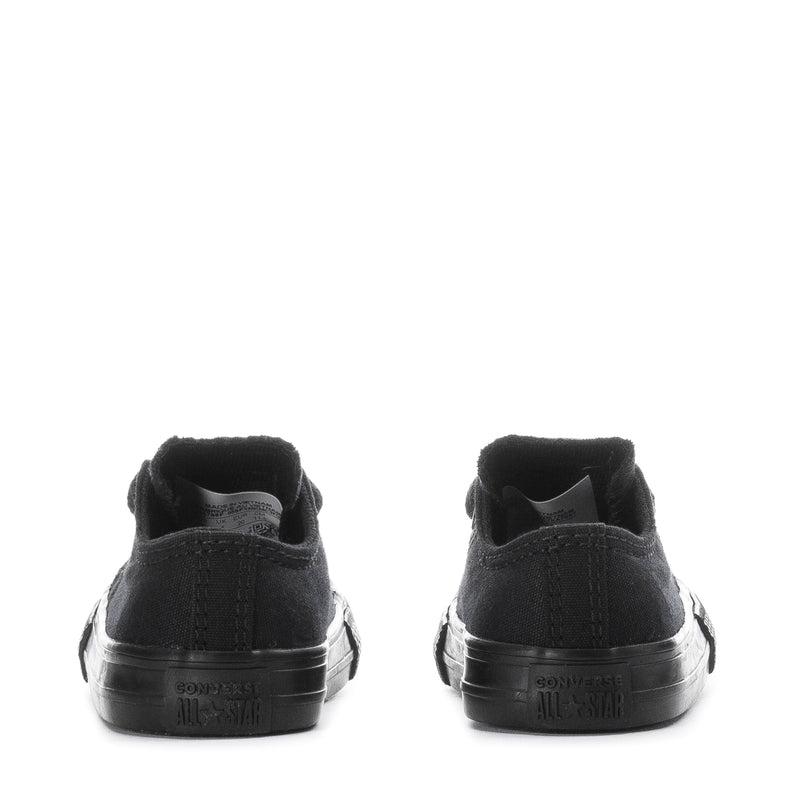 Toddler black low-top sneakers heel view with rubber bumper and rear branding