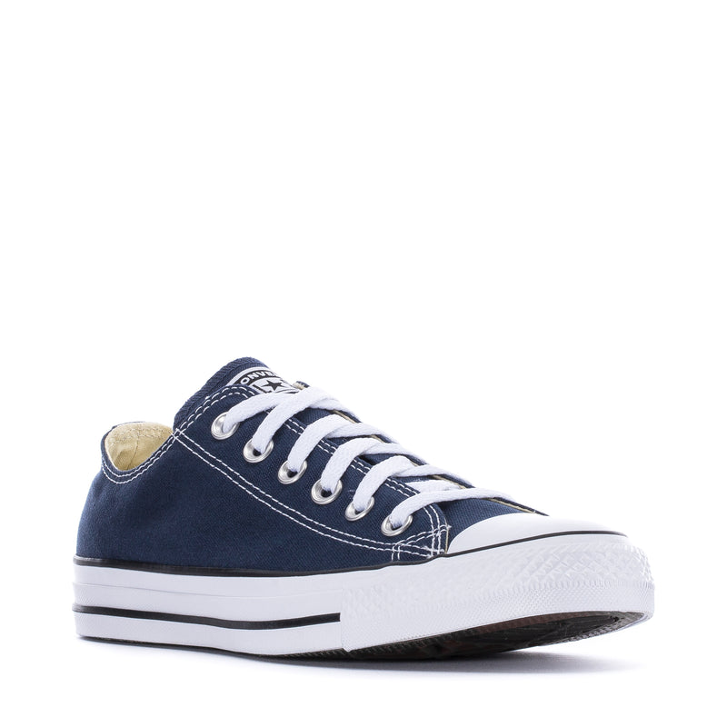 Youth navy canvas ox sneaker angled view with white laces and rubber bumper sole