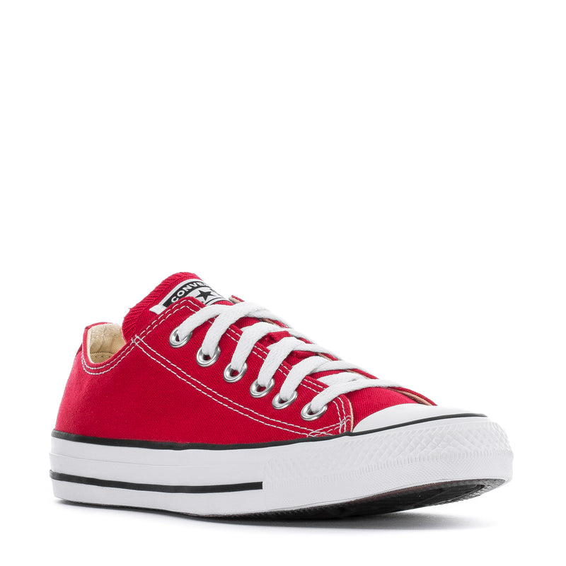 Youth red low-top Converse sneakers with white laces and black-and-white rubber side stripes