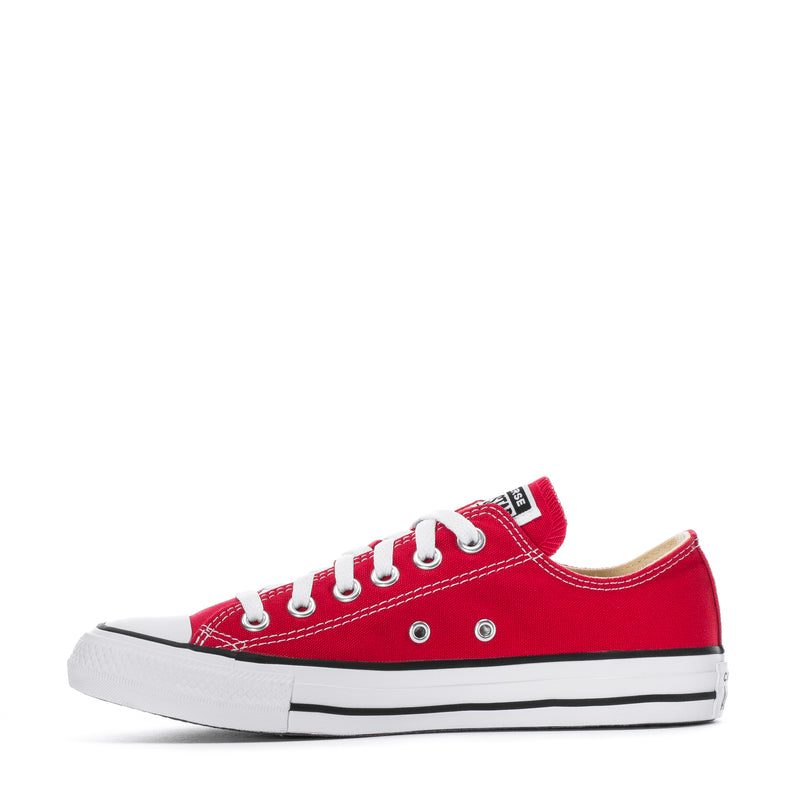 Youth red Chuck Taylor low-top with white laces, eyelets, and white sidewall