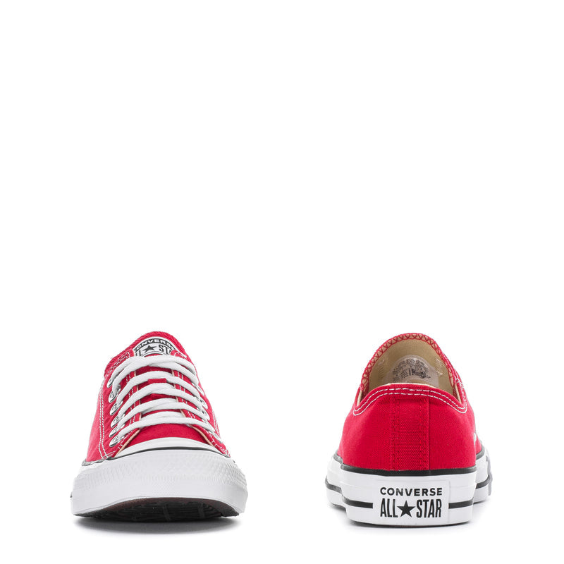 Youth red low-top sneakers showing heel patch and All Star branding on back