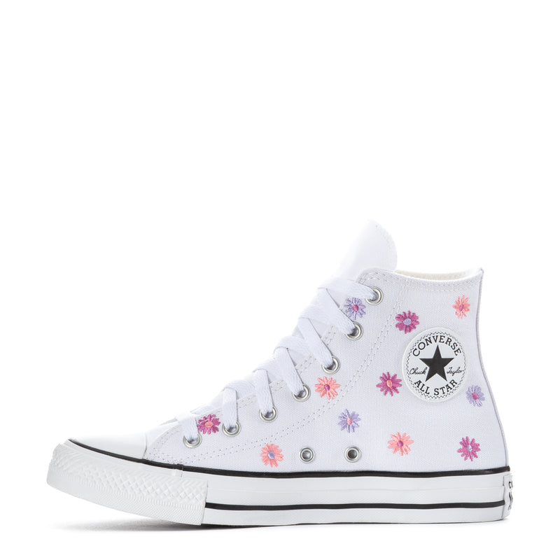 Youth white high-top sneakers with pink/purple flower print and Chuck Taylor badge