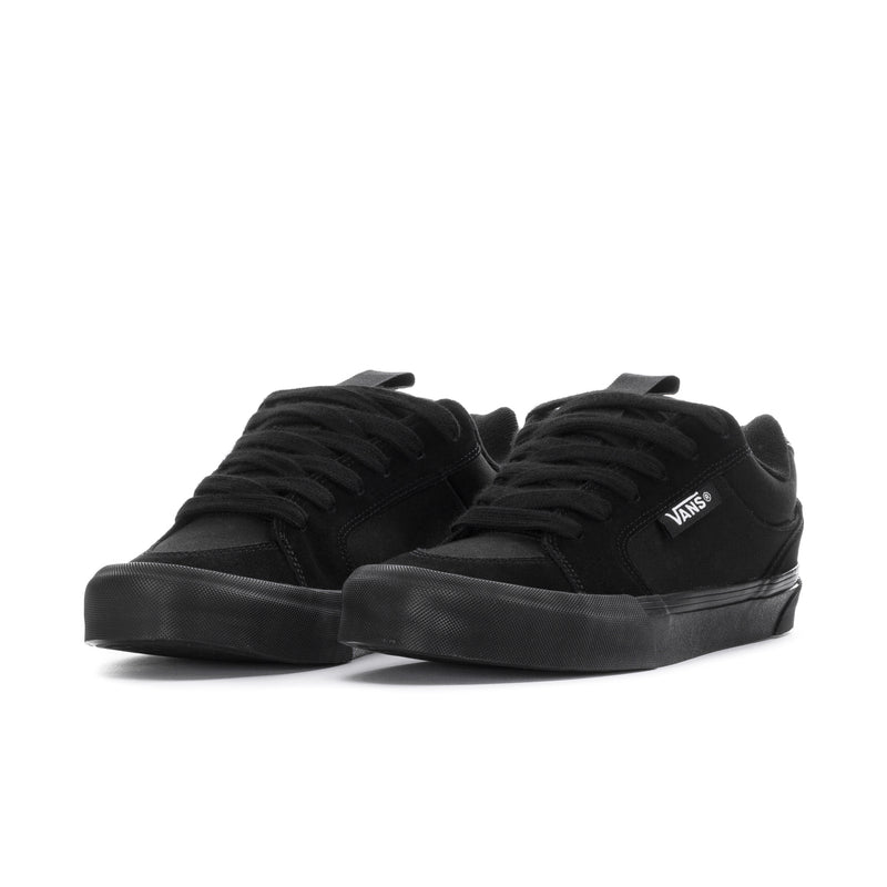 Black lace-up chukka-style sneakers, low profile, Vans logo on side