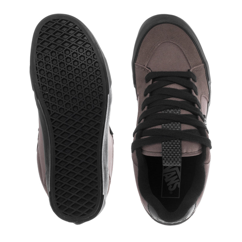 Vans sneakers with black tread outsole and mauve upper, showing lacing