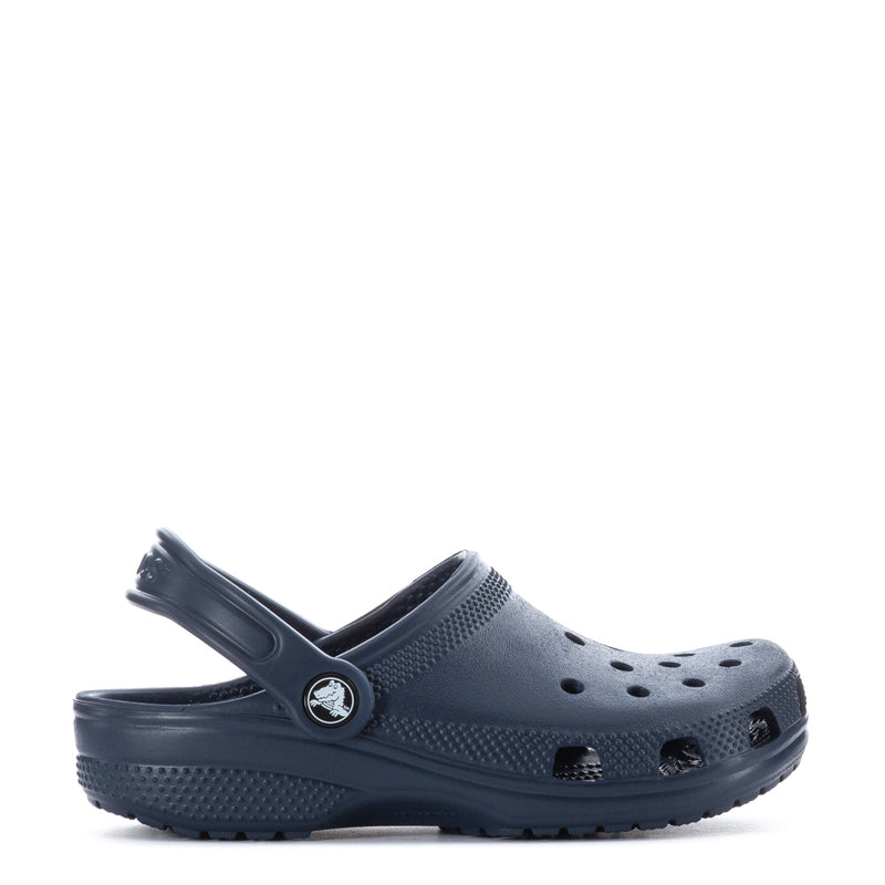 Kids' navy clog with side strap, round logo badge, and ventilation holes