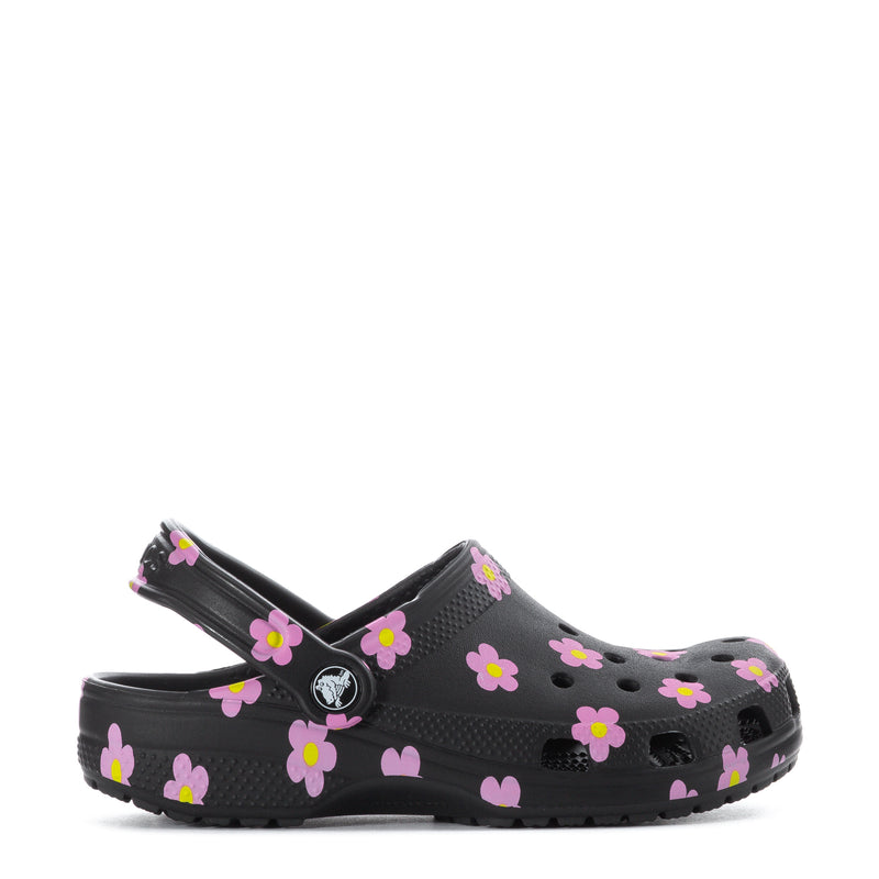 Kids' black clog with pink flower print, side vents and adjustable back strap
