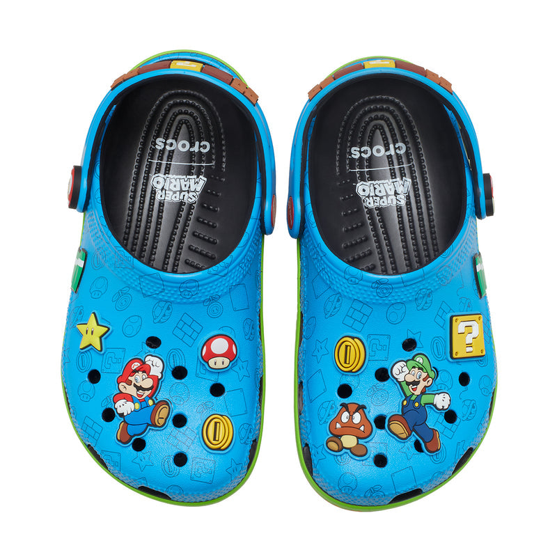 Kids blue clogs, pair shown open with black interior and colorful character artwork