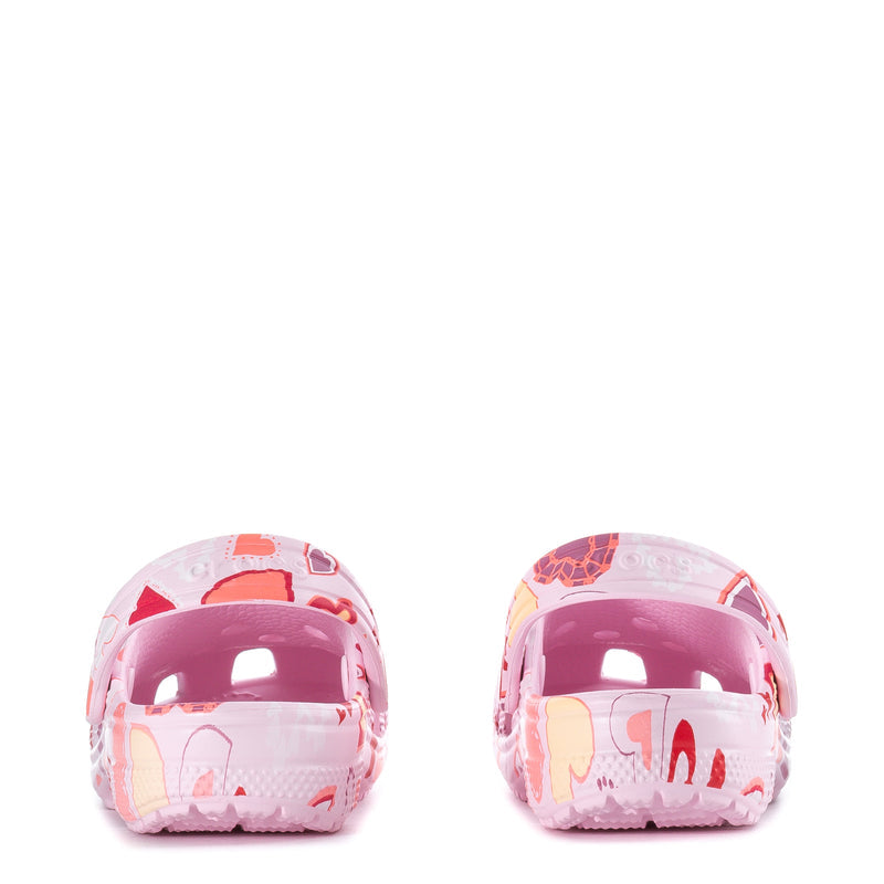 Pair of kids' pink clogs with heart-print uppers and glossy toe fronts